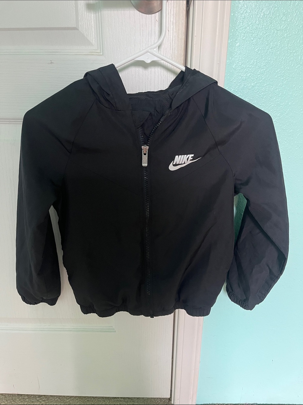 Nike Black Hooded Kids Rain Jacket with White Swoosh